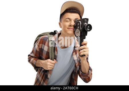 Enregistrement étudiant masculin avec une caméra vintage de 8 mm isolée sur fond blanc Banque D'Images