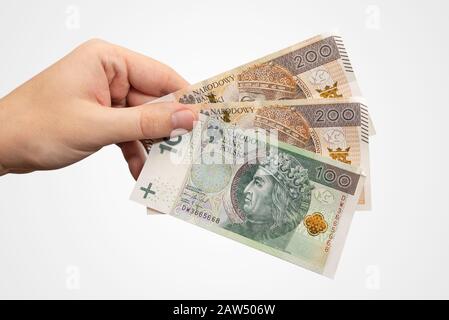 Billets de banque en PLN. Monnaie zloty polonaise, concept de salaire ou de prêt, isolée à la main Banque D'Images