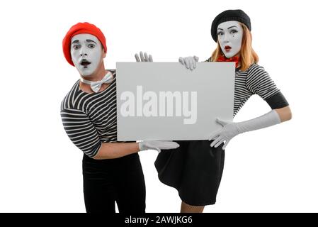 Acteurs MIME portant un placarde blanc. Espace vide pour insérer votre texte ou votre photo Banque D'Images