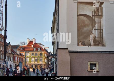 Peinture murale sur bâtiment en brique dans la vieille ville de Varsovie, Pologne Banque D'Images