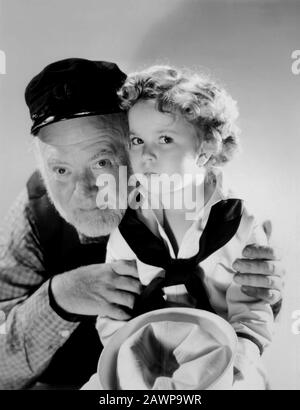 1936 , USA : L'enfant actrice SHIRLEY TEMPLE ( 1928-2014 ) avec GUY KIBBEE , pubblica encore pour le film CAPITAINE JANVIER ( Capitan Gennaio ) par Banque D'Images