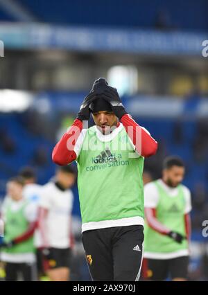 Troy Deeney de Watford ajuste son chapeau pendant le préchauffage pendant le match de la Premier League entre Brighton et Hove Albion et Watford au stade Amex Brighton, Royaume-Uni - 8 février 2020 - usage éditorial seulement. Pas de merchandising. Pour les images de football, les restrictions FA et Premier League s'appliquent inc. Aucune utilisation d'Internet/mobile sans licence FAPL - pour plus de détails, contactez Football Dataco Banque D'Images