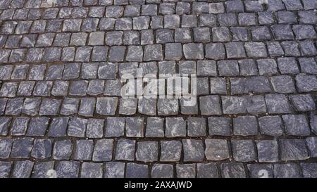 Granite pavé pavé de pierre cubique gros plan de la texture de l'arrière-plan. Fond d'écran ou texture de la chaussée Banque D'Images