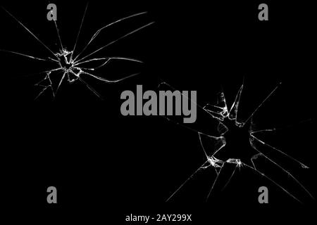 Fissures dans le verre sur un fond noir. Abstraction Banque D'Images