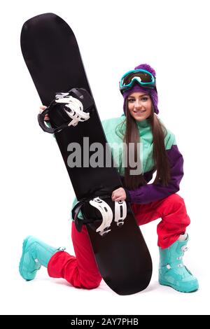 Jeune femme en tenue de ski snowboard attente violet Banque D'Images