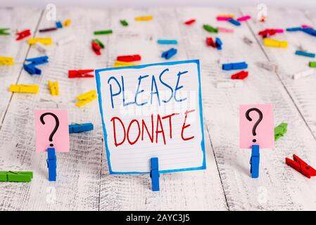 Écriture conceptuelle de la main montrant s'il vous plaît faire un don. Photo d'entreprise présentant les fournitures fournir une aide de subvention de contribution à l'organisme de bienfaisance Banque D'Images