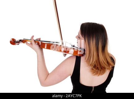 Femme jouant au violon près du dos Banque D'Images