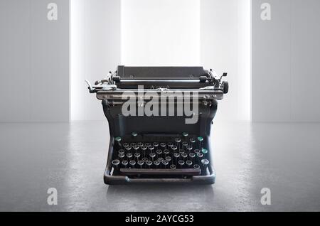Ancienne machine à écrire rétro noire vintage sur un espace vide blanc Banque D'Images