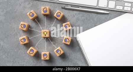 cubes montrant une séance de remue-méninges dans un espace de travail informatique moderne sur fond concret Banque D'Images