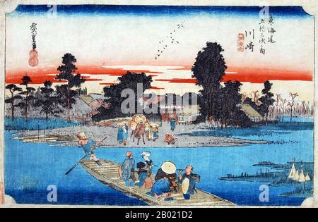 Japon : 'Station 2 : Station de Kawasaki, Ferry Boat traversant la rivière Rokugo'. Estampe sur bois ukiyo-e de la série 'cinquante-trois stations de la route de Tôkaidô' par Utagawa Hiroshige (1797-1858), vers 1834. Kawasaki : un ferry traversant la rivière, et des passagers attendant sur la rive plus loin devant un groupe de maisons ; Fuji au loin. Près de l'autre rive se trouve un homme sur un radeau. Les voyageurs qui traversent la rivière ici en ferry peuvent avoir senti qu'ils étaient transportés vers un monde différent. Cependant, ceux qui retournent à Edo attendaient avec impatience de rentrer dans la patrie familière. Banque D'Images