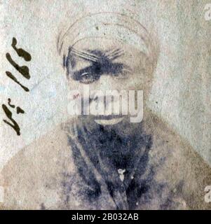 Cette photographie d'un esclave africain Libéré a été prise après qu'ils aient été libérés des navires en pente par la marine britannique. De 1861 à 1874, plus de 2500 « Africains Libérés » ont été expédiés à Port Victoria, Seychelles. Alors que le commerce des esclaves a continué à travers l'Afrique orientale et australe et l'Océan Indien, les 'libérés' ont été emmenés dans un dépôt, classé par le Magistrate de District, photographié, renommé et assigné comme 'apprentis' aux plantations d'origine française, où ils ont été indentés pendant cinq ans. Banque D'Images