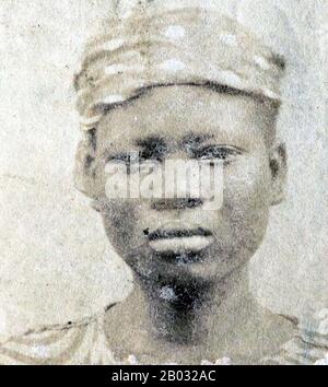 Cette photographie d'un esclave africain Libéré a été prise après qu'ils aient été libérés des navires en pente par la marine britannique. De 1861 à 1874, plus de 2500 « Africains Libérés » ont été expédiés à Port Victoria, Seychelles. Alors que le commerce des esclaves a continué à travers l'Afrique orientale et australe et l'Océan Indien, les 'libérés' ont été emmenés dans un dépôt, classé par le Magistrate de District, photographié, renommé et assigné comme 'apprentis' aux plantations d'origine française, où ils ont été indentés pendant cinq ans. Banque D'Images