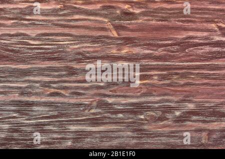 La texture de l'acajou. Table ou plancher ancien, planches brunes. Fond en bois. Banque D'Images