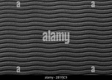 Gros plan de la surface de la texture de paroi ondulée grise pour le fond d'écran ou les fonds d'écran des appareils. Conception abstraite, matériaux habituels et naturels. Des œuvres d'art grungie détaillées. CopySpace, publicité. Style vintage. Banque D'Images