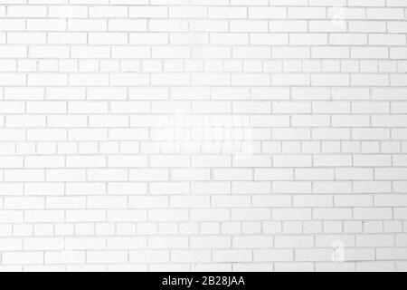 Mur en briques blanches abstraites au toucher rustique moderne. Idéal pour les arrière-plans et les textures. Banque D'Images