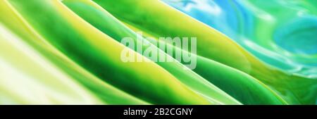 Arrière-plan abstrait avec encre de peinture verte jaune et bleue, en-tête panoramique Banque D'Images