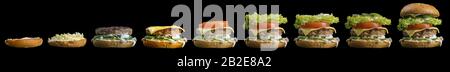 Processus permettant de burger, étape par étape isolé sur fond noir. Burger grande bannière. Burger de Split. Burger divisé en régions Banque D'Images