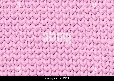 Tissu tricoté rose clair texture douce arrière-plan Banque D'Images
