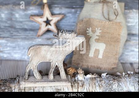 Noël rustique encore vie avec cerf et étoile en bois Banque D'Images