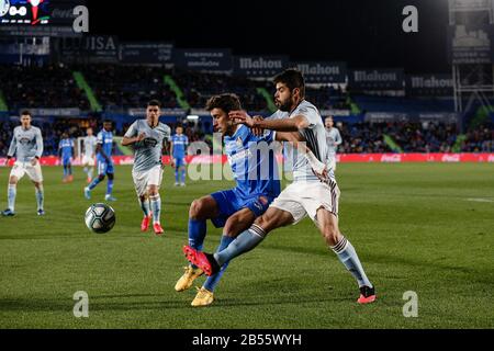 Colisée Alfonso Perez, Madrid, Espagne. 7 mars 2020. La Liga Football, Club Getafe Club De Futbol Contre Celta Vigo; Jaime Mata (Getafe Cf) Détient Le Crédit Okay Yokuslu (Celta De Vigo): Action Plus Sports/Alay Live News Banque D'Images