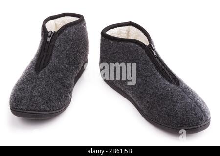 Chaussons fourrure chaude. Sur fond blanc. Banque D'Images