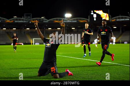 Odion Ighalo (centre gauche) de Manchester United célèbre son premier but du jeu lors de la ronde de 16 matchs de la première jambe de l'UEFA Europa League à Linzer Stadion, Linz. Banque D'Images