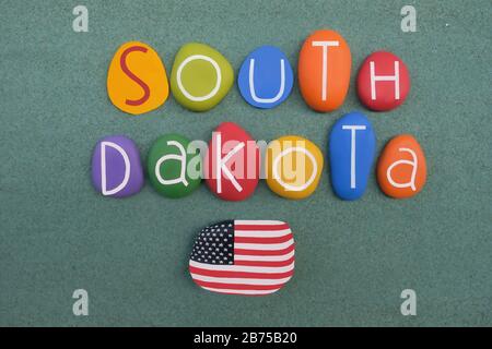 Dakota du Sud, souvenir avec des lettres en pierre de couleur sur le sable vert Banque D'Images