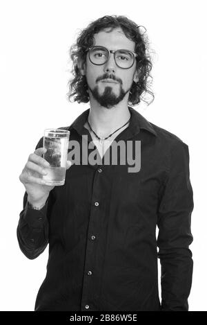 Handsome Young man holding glass of water Banque D'Images