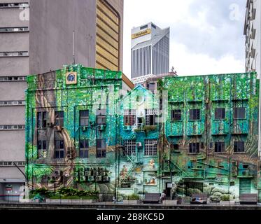 Murale représentant la vie rurale peinte sur les murs des bâtiments le long de la rivière Klang Chinatown Kuala Lumpur Malaisie. Banque D'Images