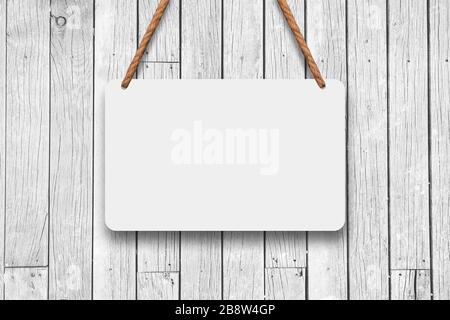 Un panneau de signalisation suspendu avec corde à un mur de bois blanc. Maquette texturée et concept de modèle Banque D'Images