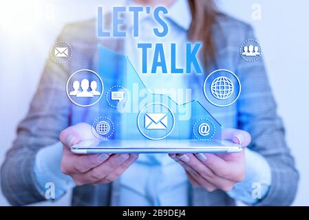 L'écriture conceptuelle de la main montrant les lets est Talk. Concept signifiant suggérant au début d'une conversation sur le sujet Banque D'Images