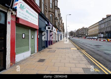 Édimbourg, Écosse, Royaume-Uni. 24 mars 2020. Rues désertes le long de Leith Walk. Tous les magasins et restaurants sont fermés avec très peu de personnes s'aventurant à l'extérieur après le maintien imposé par le gouvernement aujourd'hui. Iain Masterton/Alay Live News Banque D'Images