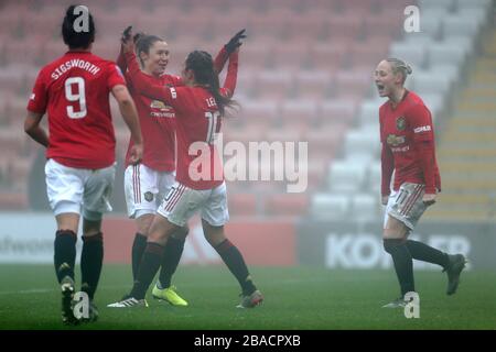 Les joueurs de Manchester United célèbrent après les scores de Katie Zalem de Manchester United sur place Banque D'Images