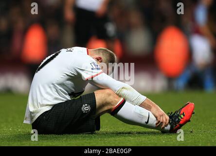 Wayne Rooney de Manchester United lutte après avoir subi une blessure Banque D'Images