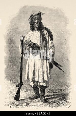 Portrait d'un soldat afghan au XIXe siècle, des voyages en Asie centrale en 1863 par Armin Vambéry. Ancienne gravure El Mundo en la Mano 1878 Banque D'Images