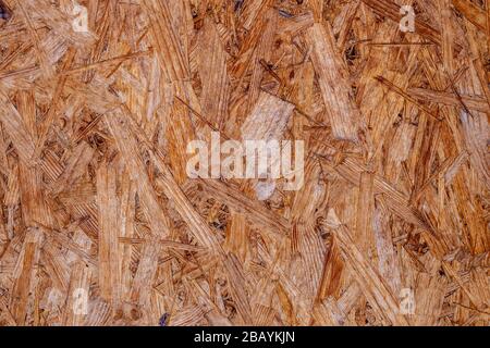 Mdf boards sont faits de copeaux de bois brun poncé dans un fond de bois. Vue de dessus du placage en bois MDF, d'arrière-plan serré, surfaces transparente Banque D'Images