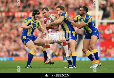 Pat Richards de Wigan Warriors et Simon Grix de Warrington Wolves, Ben Harrison et Chris Hill (à gauche) Banque D'Images