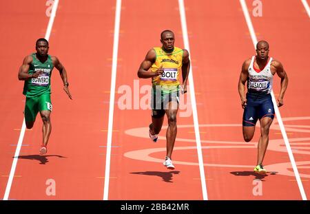 La Jamaïque Usain Bolt (au centre) se trouve à côté de James Dasaolu (à droite) et Ogho-Oghene Egwero au Nigeria dans les 100 m Heats pour hommes Banque D'Images