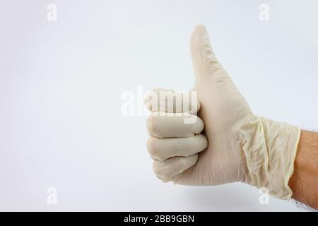 La main du médecin porte des gants pour la série de virus corona Banque D'Images