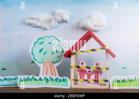 Dessiné à la main d'arbres, d'herbe et d'une famille à l'intérieur d'une maison. Concept de verrouillage dans une pandémie de crise mondiale Banque D'Images