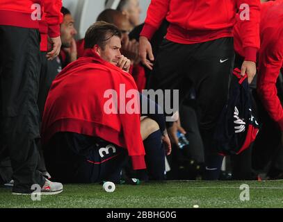 Paris Saint-Germain's David Beckham regarde les dernières minutes du banc Banque D'Images