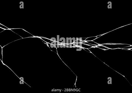 Art de rides et des fissures de verre causés par smashing et relevant les bosses. isolé sur fond noir Banque D'Images