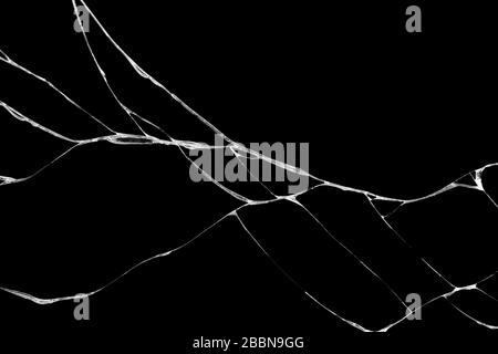 Art de rides et des fissures de verre causés par smashing et relevant les bosses. isolé sur fond noir Banque D'Images