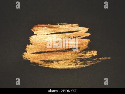 Colorant d'aquarelle doré abstrait sur fond noir pour votre conception Banque D'Images