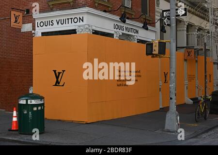Truck in front of Louis Vuitton store, New York Stock Photo - Alamy