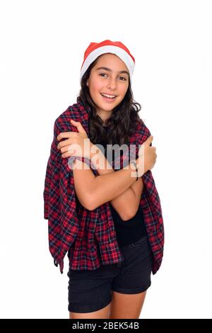 Bonne jeune fille adolescente avec chapeau de Père Noël prêt pour Noël Banque D'Images