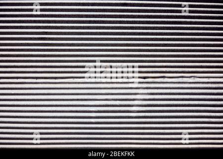 Détail gros plan d'une ancienne porte d'obturation en métal rouillée et rouillée pour une utilisation en arrière-plan ou en toile de fond. Banque D'Images