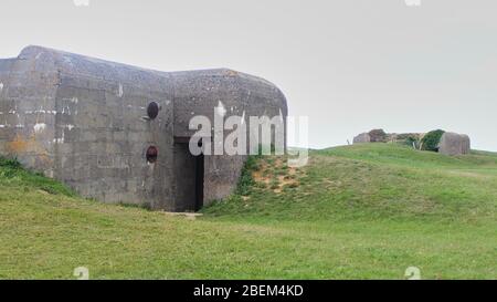 Restes de la batterie allemande qui a été capturé le 07 juin 1944, Bunker et Artillery Guns Banque D'Images