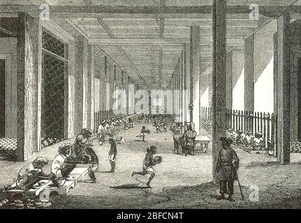 USINE D'OPIUM à Patna, Bengale, Inde, exploitée par la British East India Company vers 1860. Ici, dans la salle de Balling, l'opium brut est enveloppé dans des feuilles avant de le stocker. Banque D'Images