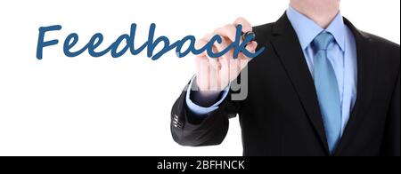 Écriture main feeback sur carte transparente Banque D'Images